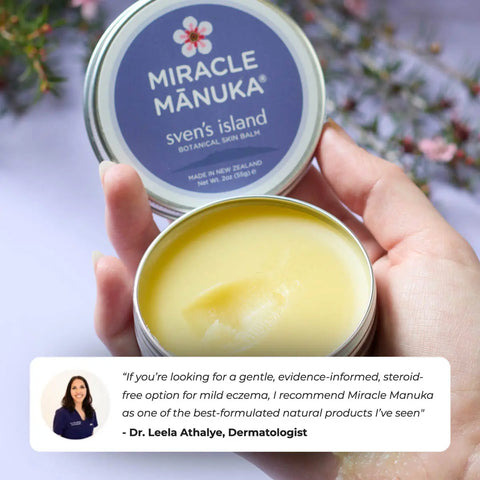 Hand holding a tin of Miracle Manuka balm with a blurred floral background and a quote with recommendation from Dr. Leela Athalye, Dermatologist.