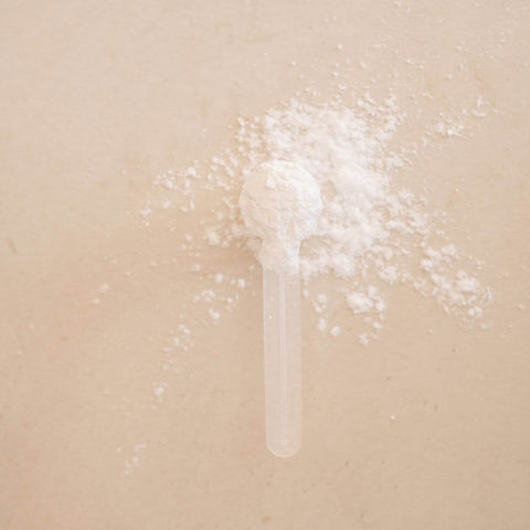 White powder on a beige background.