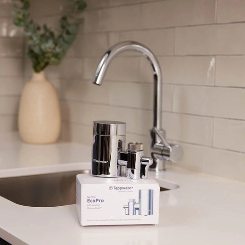 Tappwater EcoPro water filter on a kitchen counter with a sink and decorative vase in the background.