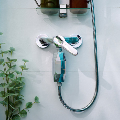 Tappwater ShowerPro Diamond Filter attached to a shower hose. Removes impurities from water to protect skin and hair.