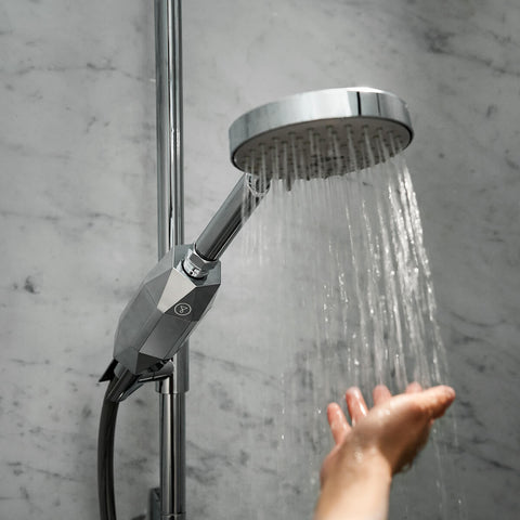 Tappwater ShowerPro Diamond Filter attached to a shower head. Removes impurities from water to protect skin and hair.