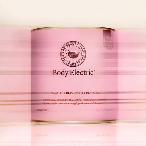 Pink canister labeled 'Body Electric' with a logo on a pink background.