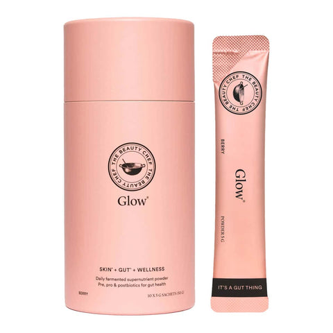 Pink container with 10 sachets of Glow daily fermented supernutrient powder.