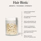 The Beauty Chef Hair Biotic supplement container with text on benefits.
