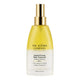 A bottle of The Jojoba Company Jojoba Firming Body Treatment, featuring a frosted bottle and a metallic gold pump dispenser, set against a plain white background.
