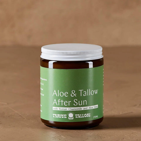 Jar of Aloe & Tallow After Sun Balm on a brown background.