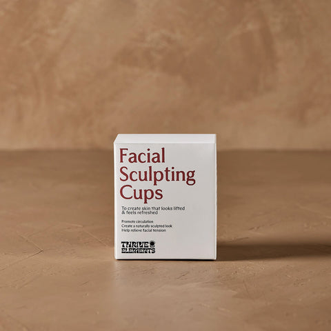 Box of Facial Sculpting Cups on a brown background.
