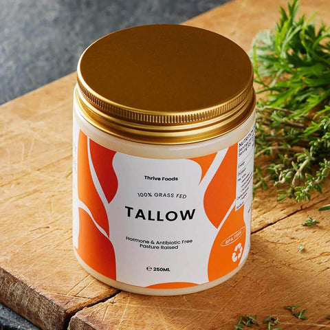 Tallow container with gold lid on a wooden surface.