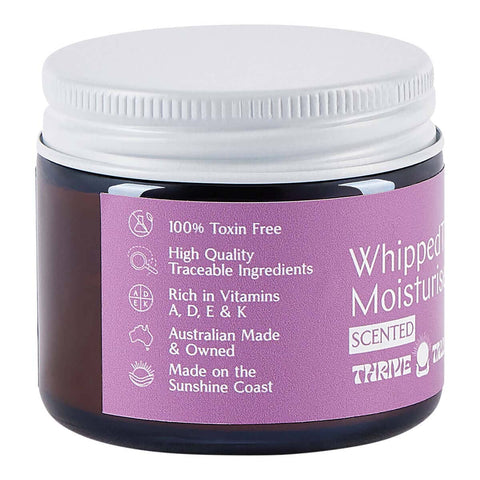 Jar of whipped moisturiser with a purple label on a white background.