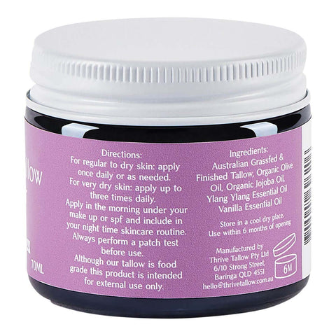 Back view of a jar with purple label containing skincare product details.