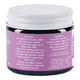 Back view of a jar with purple label containing skincare product details.