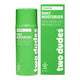 A green cylindrical bottle and matching rectangular box of Two Dudes Daily Moisturiser on a plain white background.