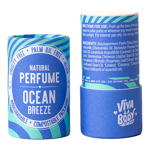 Natural perfume stick and lid labeled 'Ocean Breeze' by Viva La Body on a white background.
