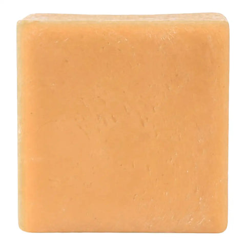 A single square bar of soap in a warm peachy-orange color, shown against a plain white background.