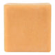 A single square bar of soap in a warm peachy-orange color, shown against a plain white background.