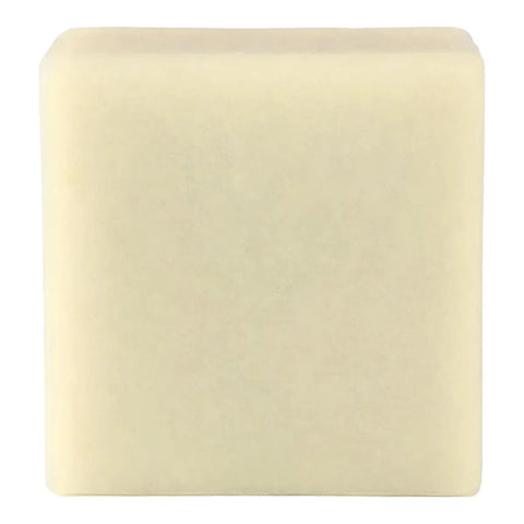 A single square bar of pale cream-coloured soap against a plain white background.