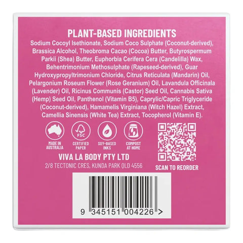 The back of a solid shampoo box, showing a list of ingredients, certification icons, QR code, and a barcode on a pink background.