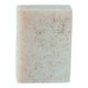 Rectangular citrus scrub bar of soap with speckled texture on a white background
