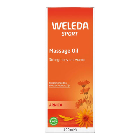 Weleda Arnica Massage Oil 100ml packaging with orange background & floral design.