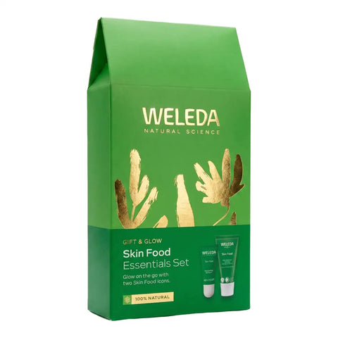 Weleda Natural Science Gift & Glow Skin Food Essentials Set in a green gift bag with gold leaf illustrations, shown on a white background.