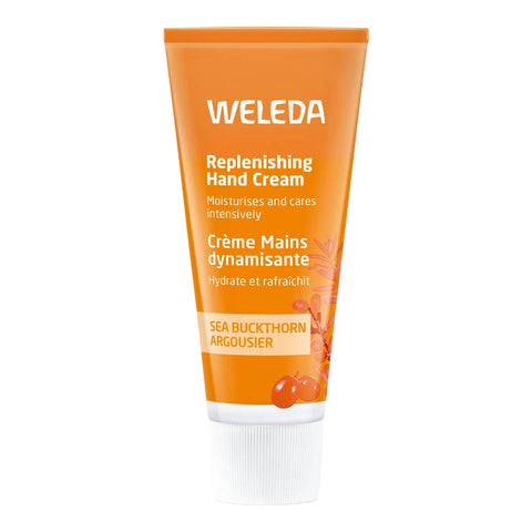 A squeeze tube of Weleda Replenishing Hand Cream in Sea Buckthorn Argousier scent, featuring a bright orange body with white text and a white ribbed cap, set against a plain white background.