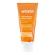 A squeeze tube of Weleda Replenishing Hand Cream in Sea Buckthorn Argousier scent, featuring a bright orange body with white text and a white ribbed cap, set against a plain white background.