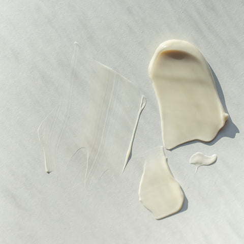 White cream on a grey background.