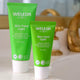 Two green Weleda Skin Food Light tubes on a blurred background