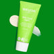 Weleda Skin Food Light tube on a green background