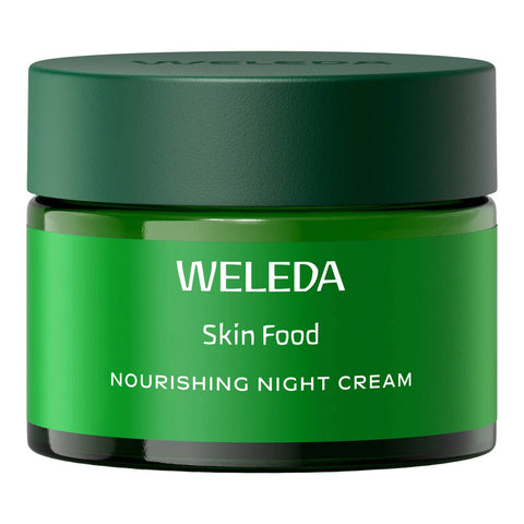 A jar of Weleda Skin Food Nourishing Night Cream, featuring a dark green lid and a bright green label with white text, set against a plain white background.