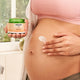 Pregnant belly with Welda Stretch Mark Body Butter 150ml application.