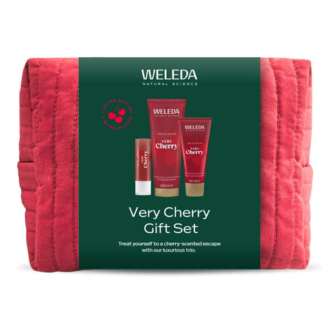 Weleda Very Cherry Gift Set - trio of skincare products in a red toiletry bag. Green packaging.