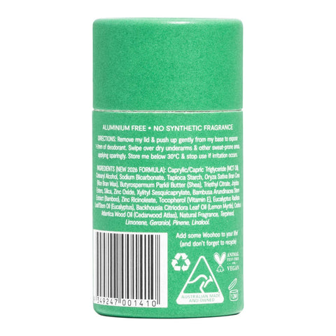 The back of a green cylindrical deodorant stick container, showing the text ingredients, barcode, and recycling symbols on a white background.