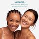 Two women smiling with untinted zinc stick - for all skin tones. Blends clear leaving a soft primed finish.